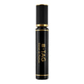 Black and gold perfume bottle with '#-TAG' branding on a white background