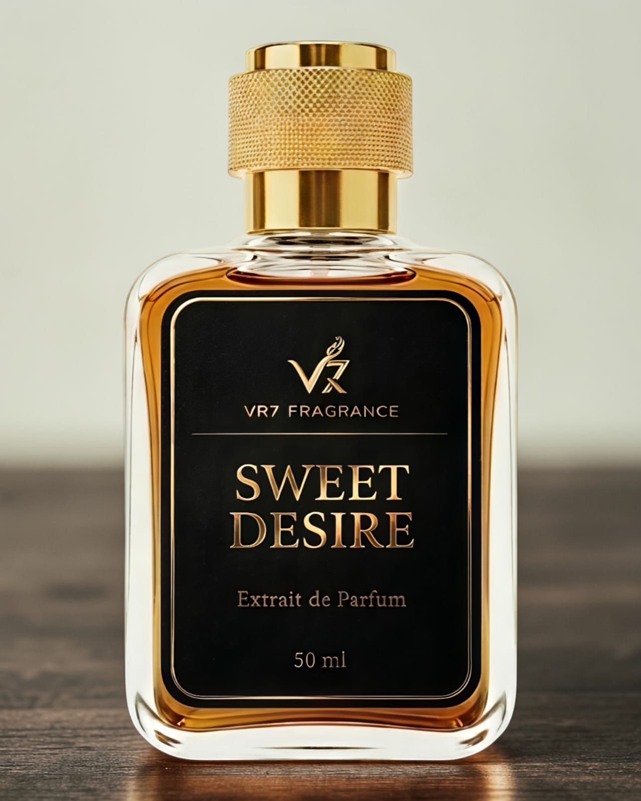 Perfume bottle labeled 'Sweet Desire' by VR7 Fragrance on a wooden surface with a neutral background